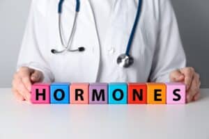 Doctor,Near,Word,Hormones,Made,With,Colorful,Cubes,At,White